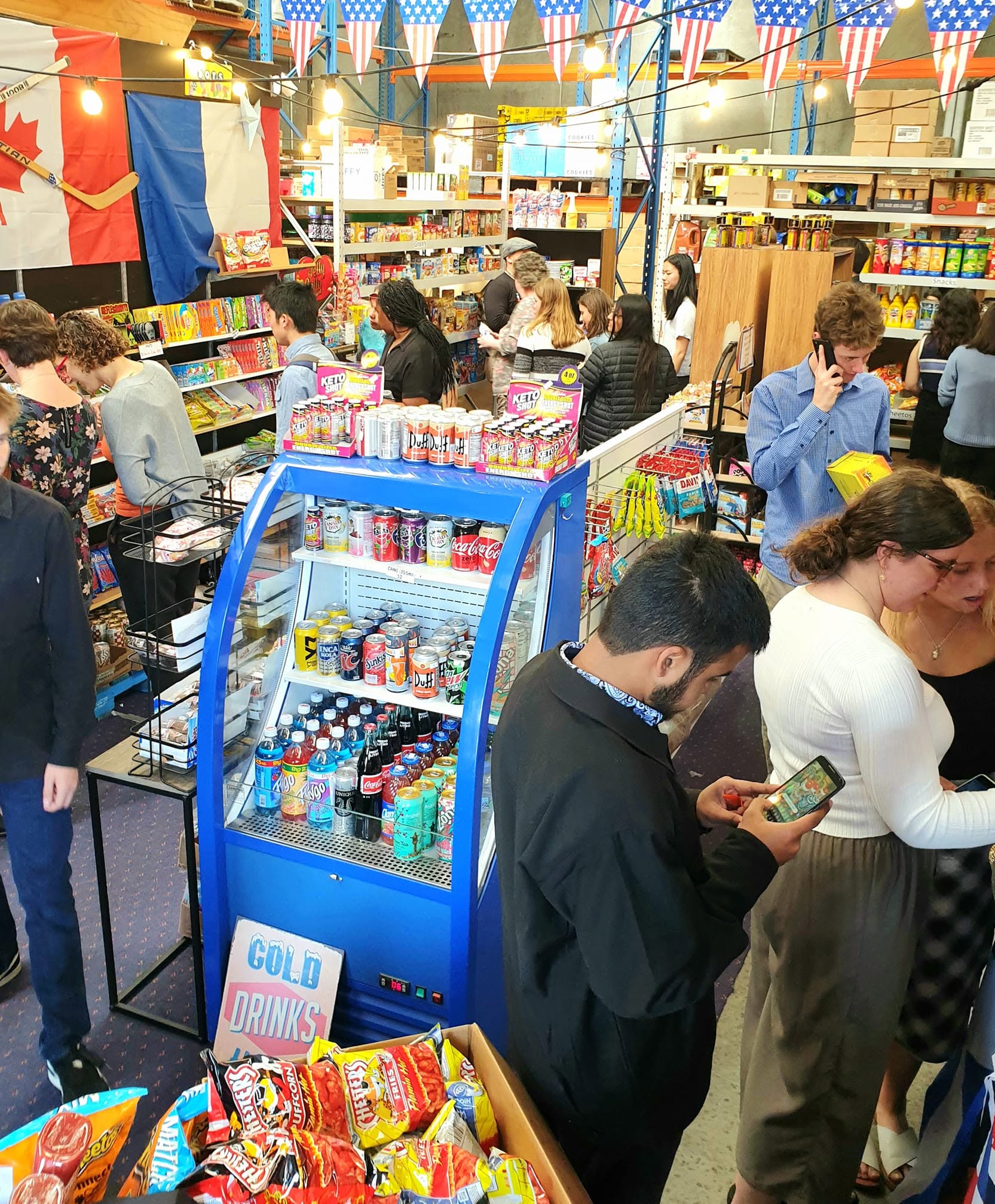 Customers shopping inside the International Foods retail store
