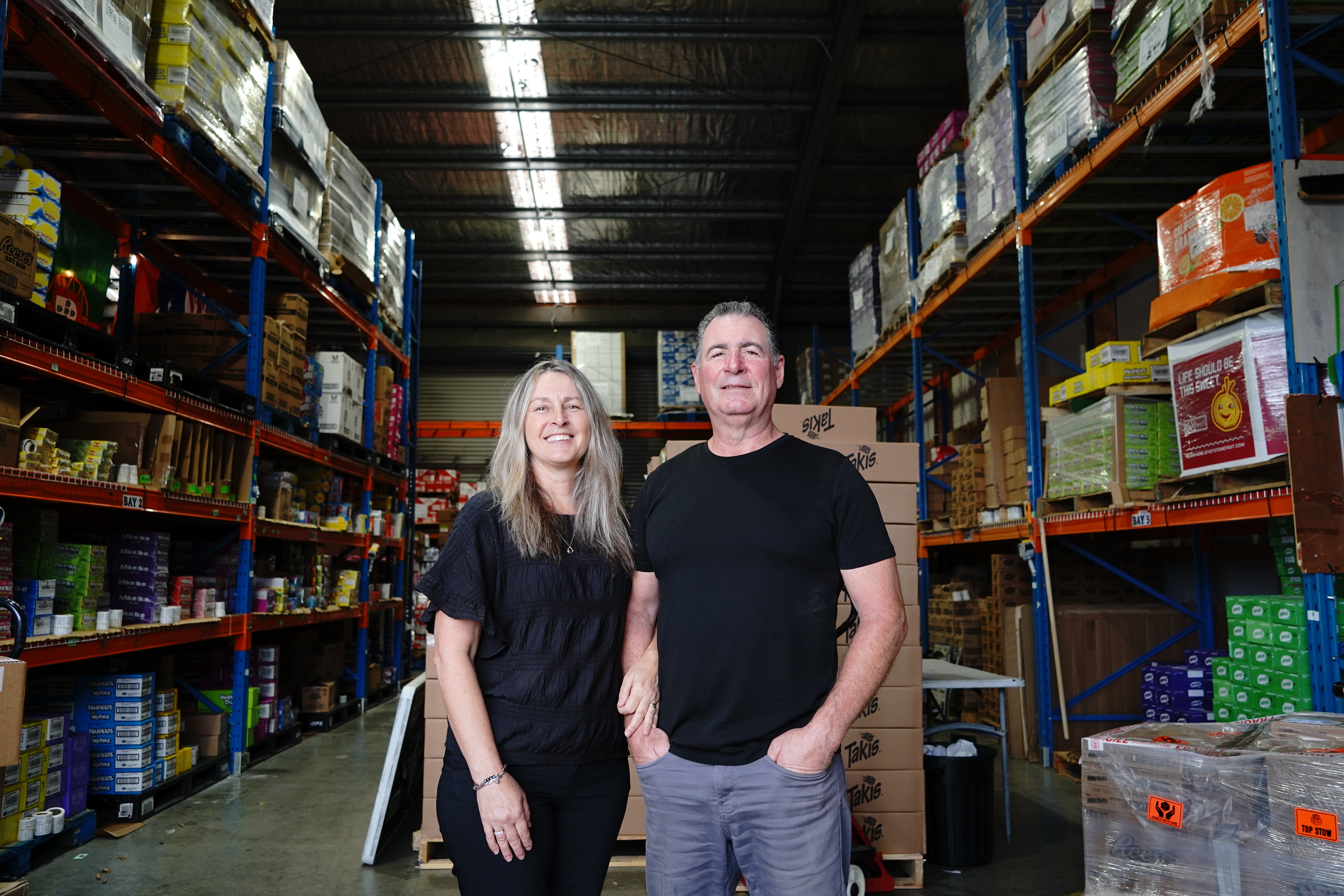 Steve and Leigh Sartin in the International Foods warehouse